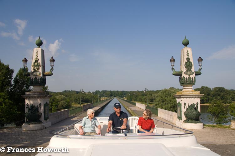 Moo, Michael and Diana on the Magnifique Connoisseur canal boat going over the Briare Canal Brige towards Briare