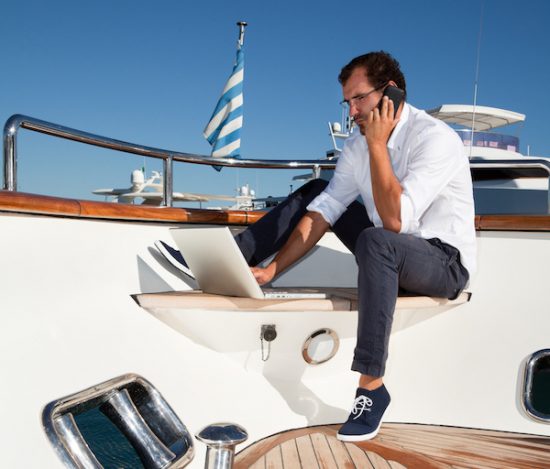 Businessman on board of the yacht