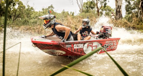 Competitors perform during the Red Bull Dinghy Derby held on the Murray River in Renmark, Australia 